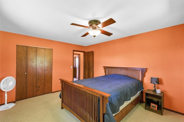 bedroom featuring light colored carpet and ceiling fan