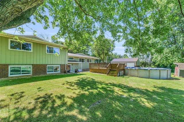 view of yard featuring a swimming pool side deck