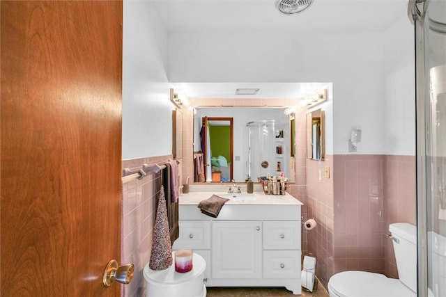 1283 N 1400 E Rd, Shelbyville, IL 62565 - bathroom featuring tile walls, toilet, vanity, wainscoting, and a shower with door