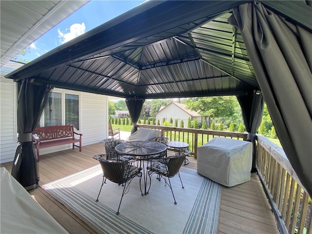 2248 Seneca Dr, Charleston, IL 61920 - deck with outdoor dining area, a gazebo, and a grill