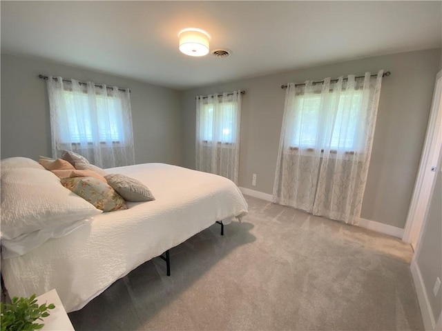 2248 Seneca Dr, Charleston, IL 61920 - bedroom with baseboards and light colored carpet