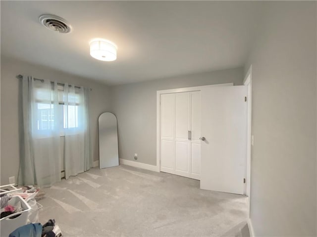 2248 Seneca Dr, Charleston, IL 61920 - unfurnished bedroom with light colored carpet and a closet