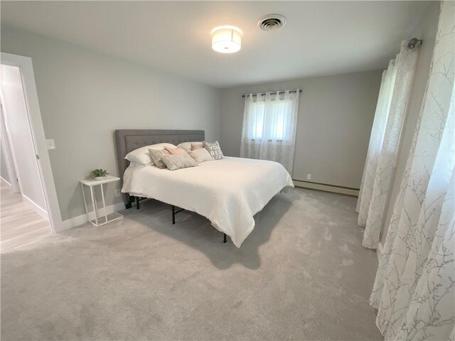 2248 Seneca Dr, Charleston, IL 61920 - bedroom with baseboard heating and carpet