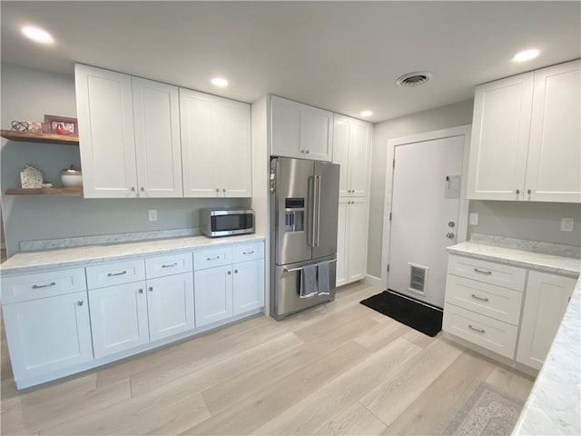 2248 Seneca Dr, Charleston, IL 61920 - kitchen featuring stainless steel appliances, light wood-style floors, white cabinetry, and recessed lighting