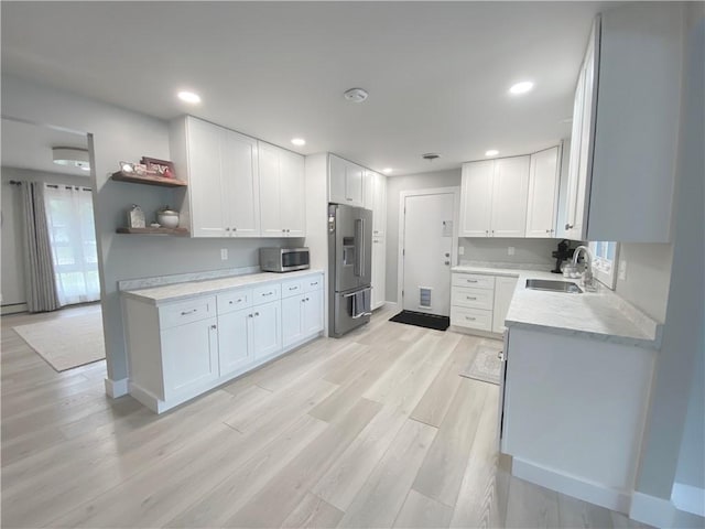 2248 Seneca Dr, Charleston, IL 61920 - kitchen featuring appliances with stainless steel finishes, light wood-style floors, open shelves, white cabinets, and recessed lighting