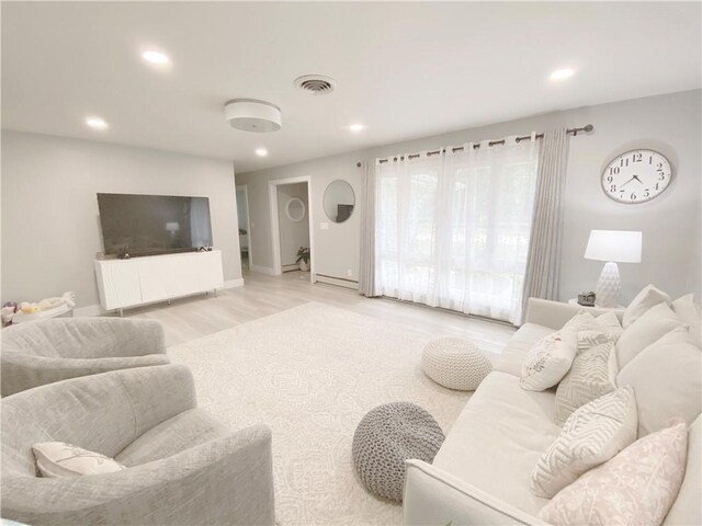 2248 Seneca Dr, Charleston, IL 61920 - living area featuring recessed lighting, wood finished floors, and radiator