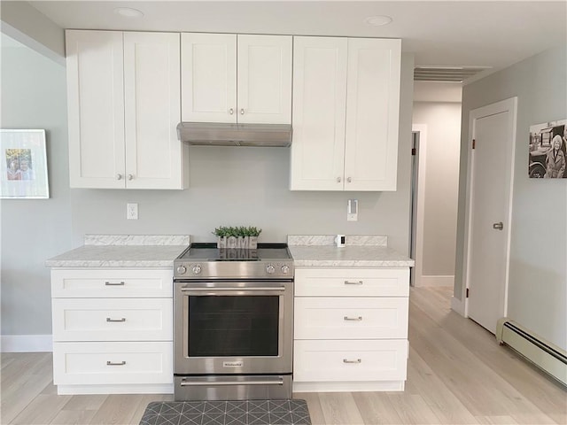 2248 Seneca Dr, Charleston, IL 61920 - kitchen with electric range, a baseboard heating unit, under cabinet range hood, light wood-style floors, and white cabinetry