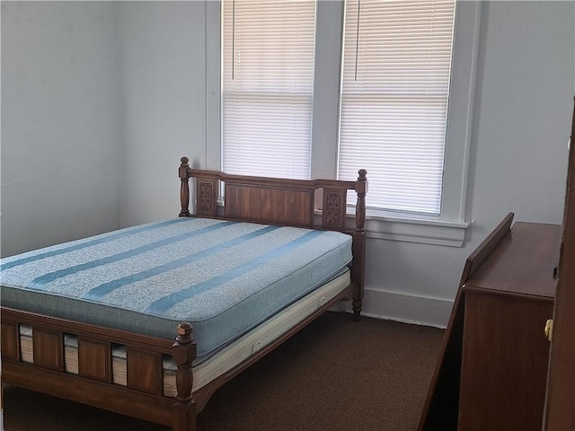508 S Webster St, Robinson, IL 62454 - bedroom with baseboards and dark colored carpet