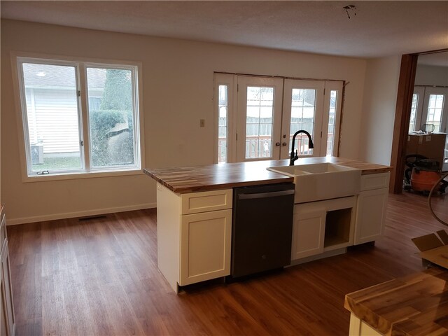 202 S 4th St, Marshall, IL 62441 - kitchen with dishwashing machine, french doors, butcher block countertops, dark wood-type flooring, and white cabinetry