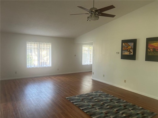 202 S 4th St, Marshall, IL 62441 - empty room featuring ceiling fan, dark wood-style floors, and high vaulted ceiling