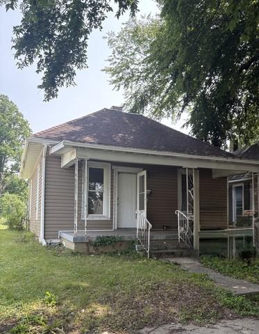 1753 E Clay St, Decatur, IL 62521 - bungalow-style house featuring a porch, a front lawn, and a shingled roof