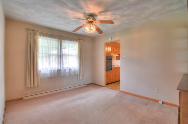 16 Diane Rd, Decatur, IL 62526 - unfurnished room with a baseboard heating unit, a ceiling fan, light carpet, and baseboards