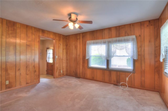 16 Diane Rd, Decatur, IL 62526 - unfurnished room featuring ceiling fan, wood walls, and carpet