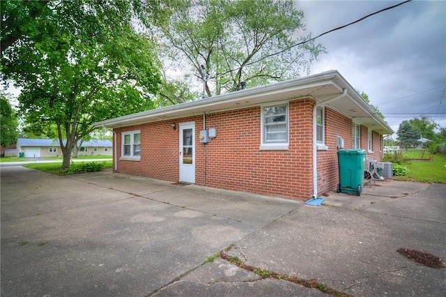 16 Diane Rd, Decatur, IL 62526 - view of front of house with brick siding, driveway, and cooling unit