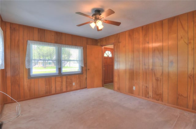 16 Diane Rd, Decatur, IL 62526 - foyer entrance featuring carpet flooring, wood walls, and a ceiling fan