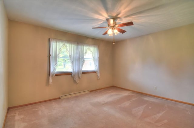 16 Diane Rd, Decatur, IL 62526 - empty room featuring baseboard heating, a ceiling fan, light colored carpet, and baseboards