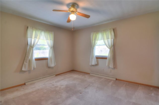 16 Diane Rd, Decatur, IL 62526 - unfurnished room featuring baseboard heating, a baseboard heating unit, plenty of natural light, and a ceiling fan