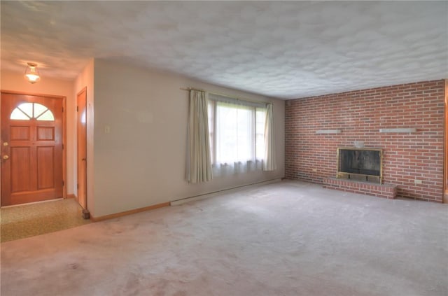 16 Diane Rd, Decatur, IL 62526 - unfurnished living room with carpet flooring, a fireplace, and baseboards