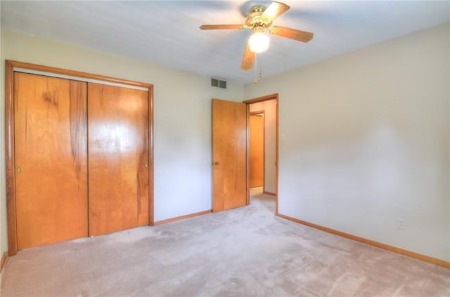 16 Diane Rd, Decatur, IL 62526 - unfurnished bedroom with a closet, carpet, baseboards, and ceiling fan