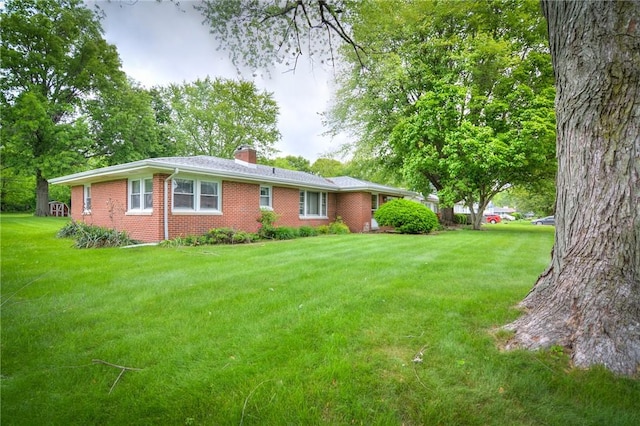 16 Diane Rd, Decatur, IL 62526 - view of front of property with brick siding, a chimney, and a front yard