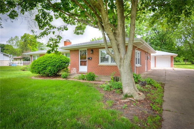 16 Diane Rd, Decatur, IL 62526 - view of front of house featuring brick siding, a chimney, a front yard, and a detached garage