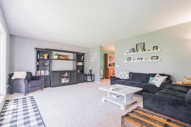 living area featuring carpet floors