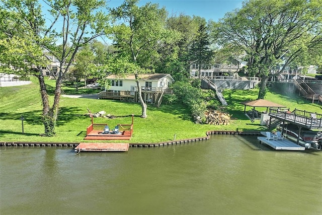 view of dock featuring stairway, a yard, and a deck with water view