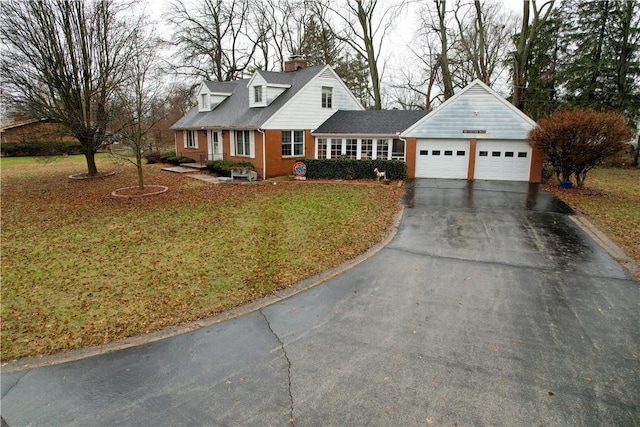 cape cod house featuring a front lawn