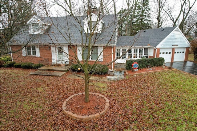 cape cod house with a garage