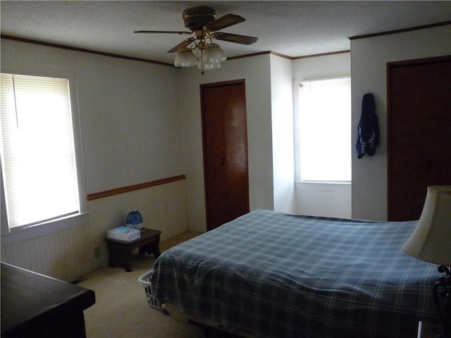 1402 Dean St, Danville, IL 61832 - bedroom with carpet, ornamental molding, and a ceiling fan