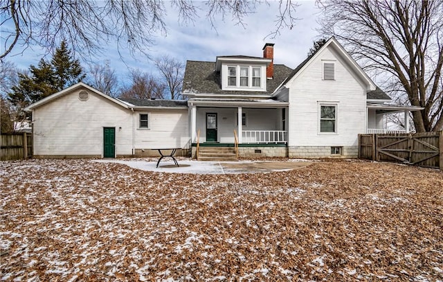 snow covered property featuring a porch