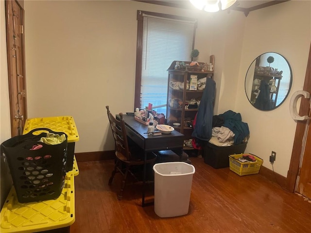 home office with dark hardwood / wood-style flooring