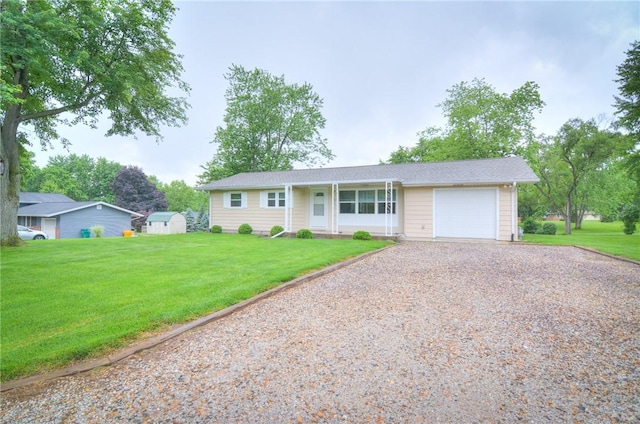 7 Mcdonald Ave, Forsyth, IL 62535 - single story home featuring a garage, gravel driveway, a front yard, and a storage unit