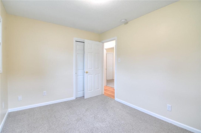 7 Mcdonald Ave, Forsyth, IL 62535 - unfurnished bedroom with carpet floors and a closet