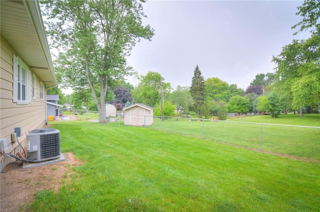 7 Mcdonald Ave, Forsyth, IL 62535 - fenced backyard with a storage unit and view of wooded area