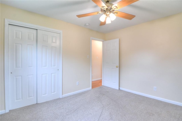 7 Mcdonald Ave, Forsyth, IL 62535 - unfurnished bedroom featuring carpet, a closet, and ceiling fan