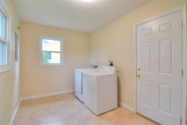 7 Mcdonald Ave, Forsyth, IL 62535 - laundry room featuring washer and dryer, electric panel, and light tile patterned floors