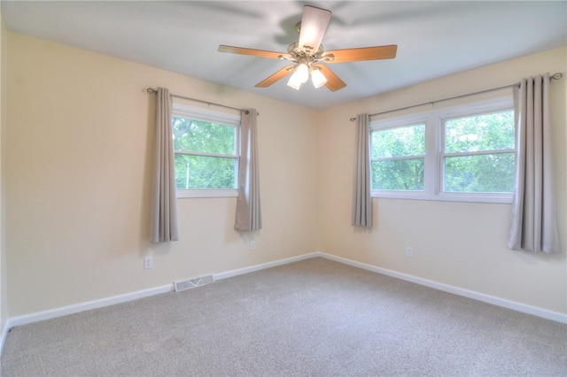 7 Mcdonald Ave, Forsyth, IL 62535 - empty room featuring plenty of natural light, carpet, and ceiling fan