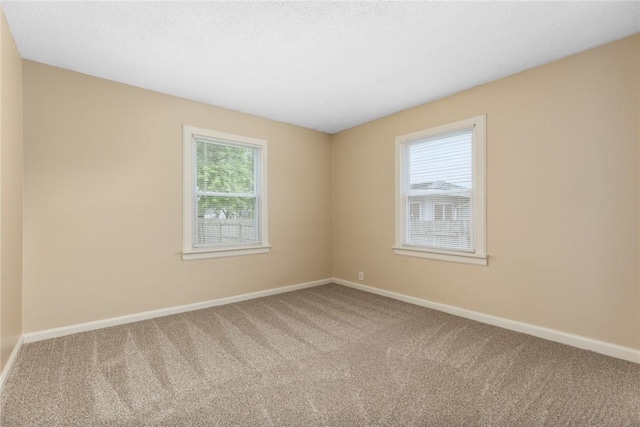 911 Saint Anthony Ave, Effingham, IL 62401 - carpeted spare room with baseboards