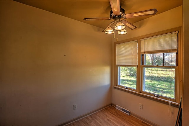 unfurnished room featuring ceiling fan and light hardwood / wood-style flooring