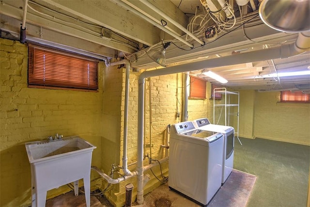 580 Powers Ln, Decatur, IL 62522 - unfinished below grade area with separate washer and dryer, a sink, and brick wall