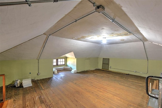 580 Powers Ln, Decatur, IL 62522 - additional living space with hardwood / wood-style flooring and lofted ceiling