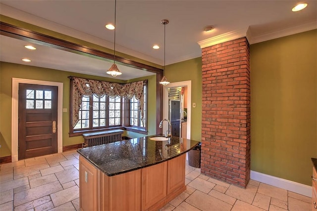 580 Powers Ln, Decatur, IL 62522 - kitchen featuring a sink, dark stone countertops, baseboards, an island with sink, and recessed lighting