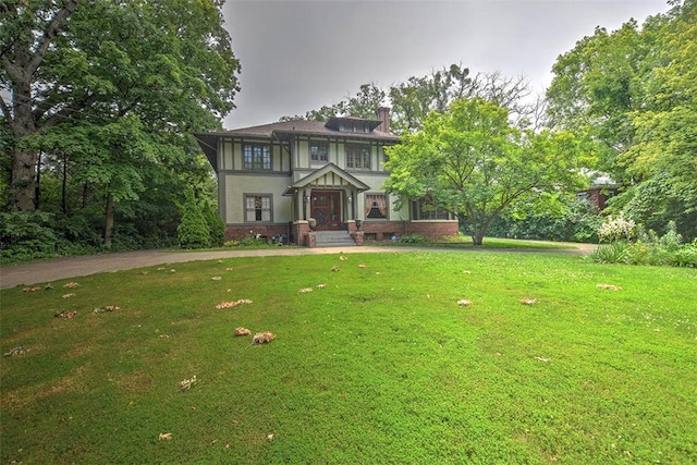 580 Powers Ln, Decatur, IL 62522 - view of front of home featuring a chimney and a front yard
