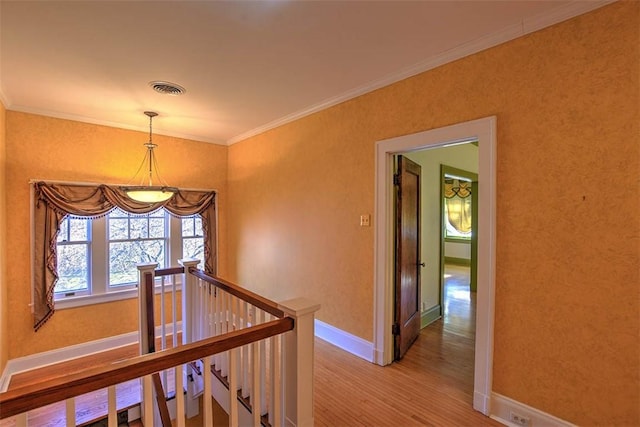 580 Powers Ln, Decatur, IL 62522 - corridor featuring an upstairs landing, wood finished floors, ornamental molding, baseboards, and a chandelier