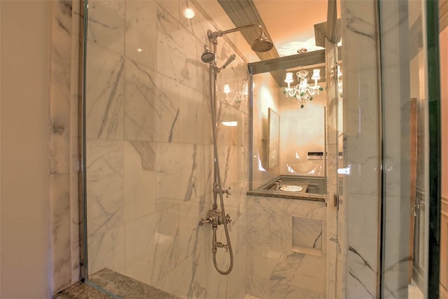 bathroom with a shower with door