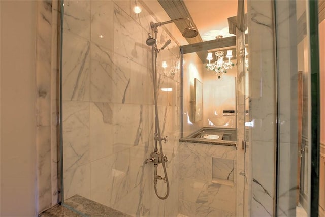 580 Powers Ln, Decatur, IL 62522 - full bathroom featuring a marble finish shower and a chandelier