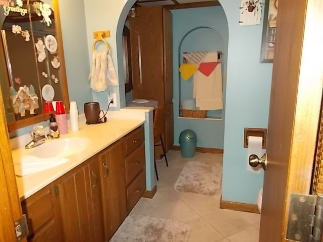 bathroom with tile patterned flooring and vanity