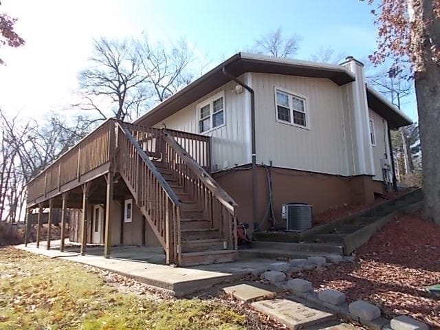 back of house featuring a patio, a deck, and central AC unit