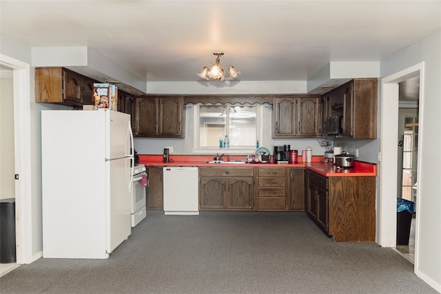 317 Madison St, Moweaqua, IL 62550 - kitchen featuring sink, carpet, white appliances, and a notable chandelier
